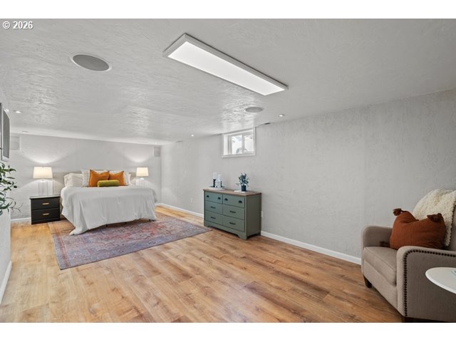 561 East Ridgeway Avenue Hermiston, OR 97838 - Photo 17 of 46 a bedroom with furniture and a wooden floor