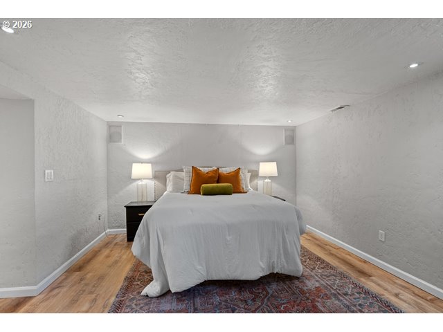 561 East Ridgeway Avenue Hermiston, OR 97838 - Photo 18 of 46 a bedroom with a bed and a night stand