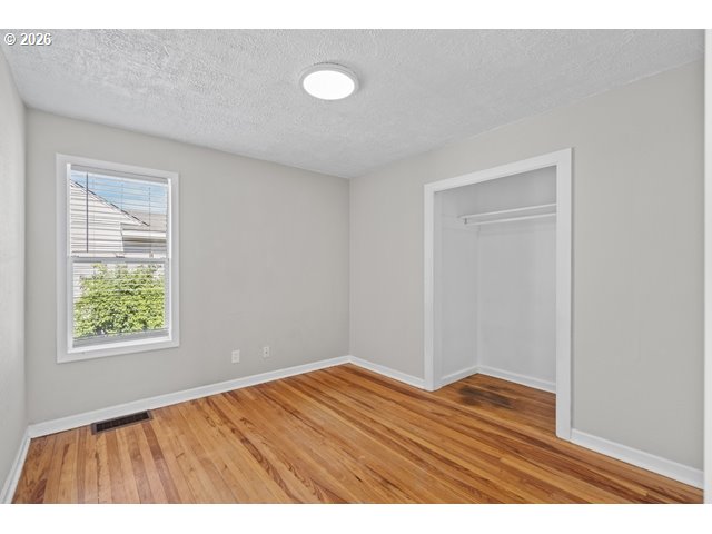561 East Ridgeway Avenue Hermiston, OR 97838 - Photo 24 of 46 a view of an empty room and wooden floor