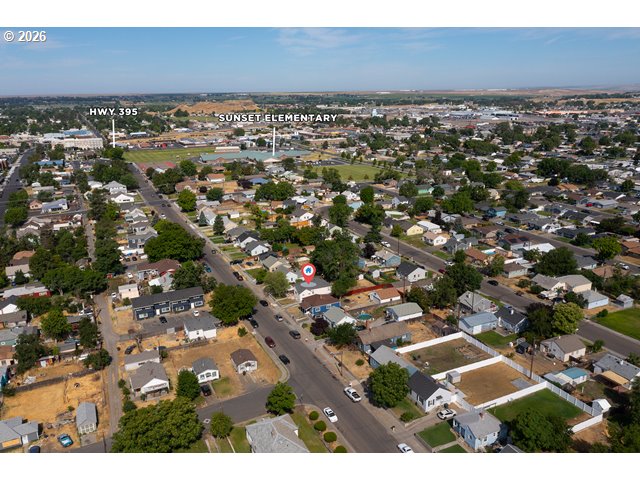 561 East Ridgeway Avenue Hermiston, OR 97838 - Photo 38 of 46 an aerial view of residential houses with outdoor space