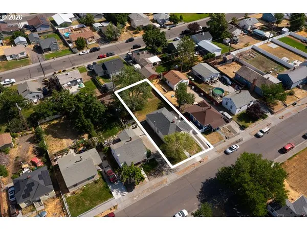 an aerial view of houses with yard