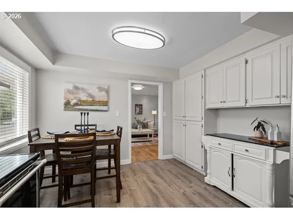 a kitchen with a table and chairs in it