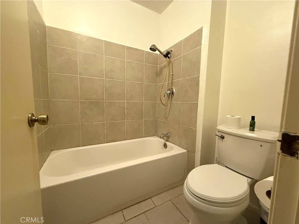 860 Cinnamon Lane, Unit 55 Duarte, CA 91010 - Photo 11 of 13 a white bath tub sitting next to a toilet