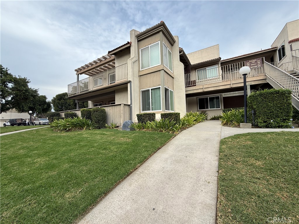 860 Cinnamon Lane, Unit 55 Duarte, CA 91010 - Photo 13 of 13 a front view of house with yard and green space