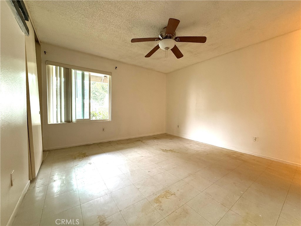 860 Cinnamon Lane, Unit 55 Duarte, CA 91010 - Photo 9 of 13 a view of an empty room with a window