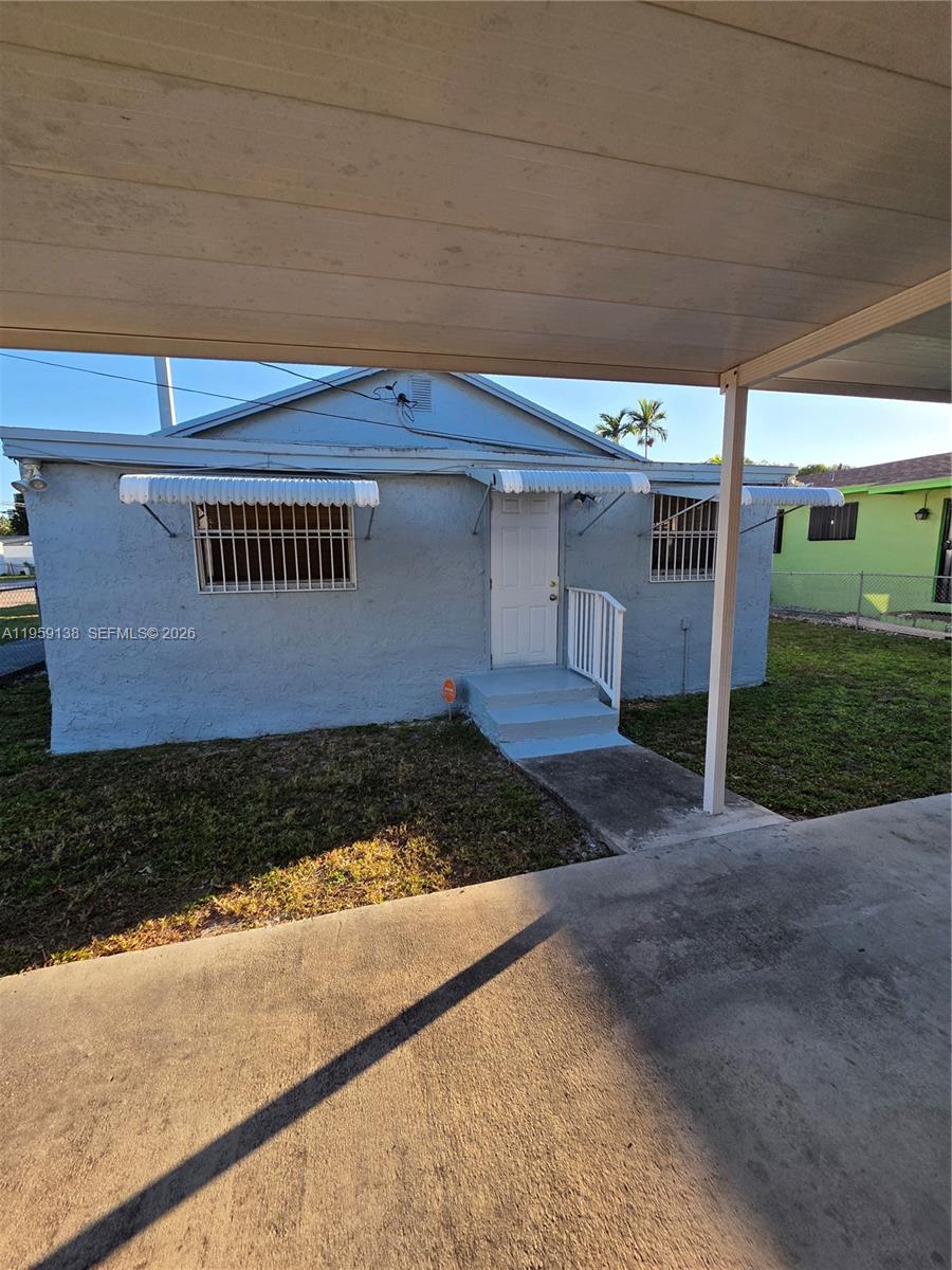 2401 Northwest 56th Street Miami, FL 33142 - Photo 14 of 15 REAR EXTERIOR