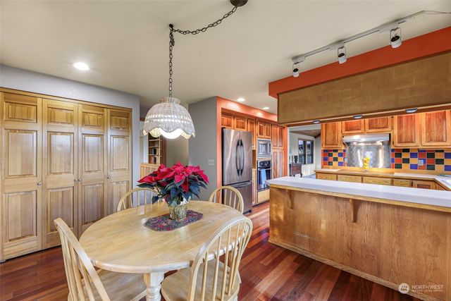 a view of a dining room with furniture window and wooden floor