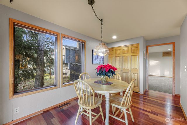 a view of room with workspace and windows