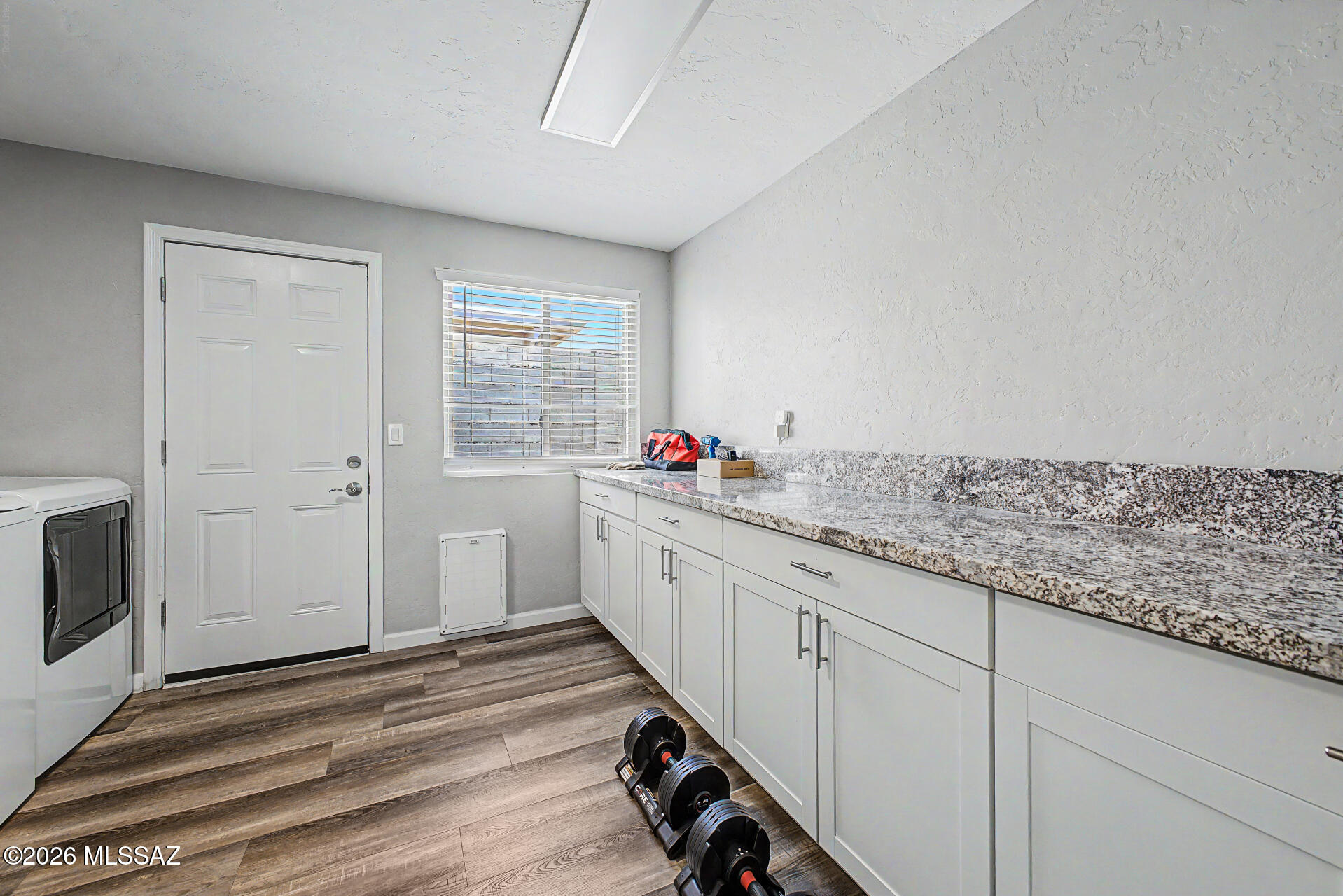3249 South Serena Circle Tucson, AZ 85730 - Photo 24 of 27 Laundry room with lots of storage and counter space.