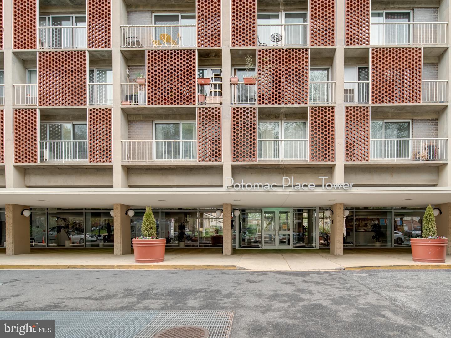 a front view of building with a garden
