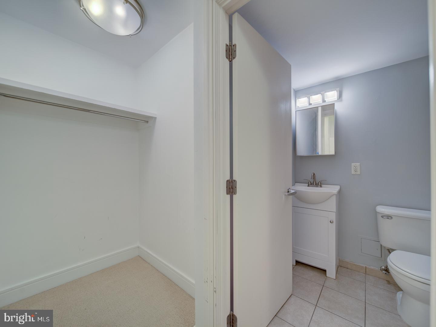 800 4th Street Southwest, Unit N703 Washington, DC 20024 - Photo 21 of 25 a bathroom with a toilet and a sink