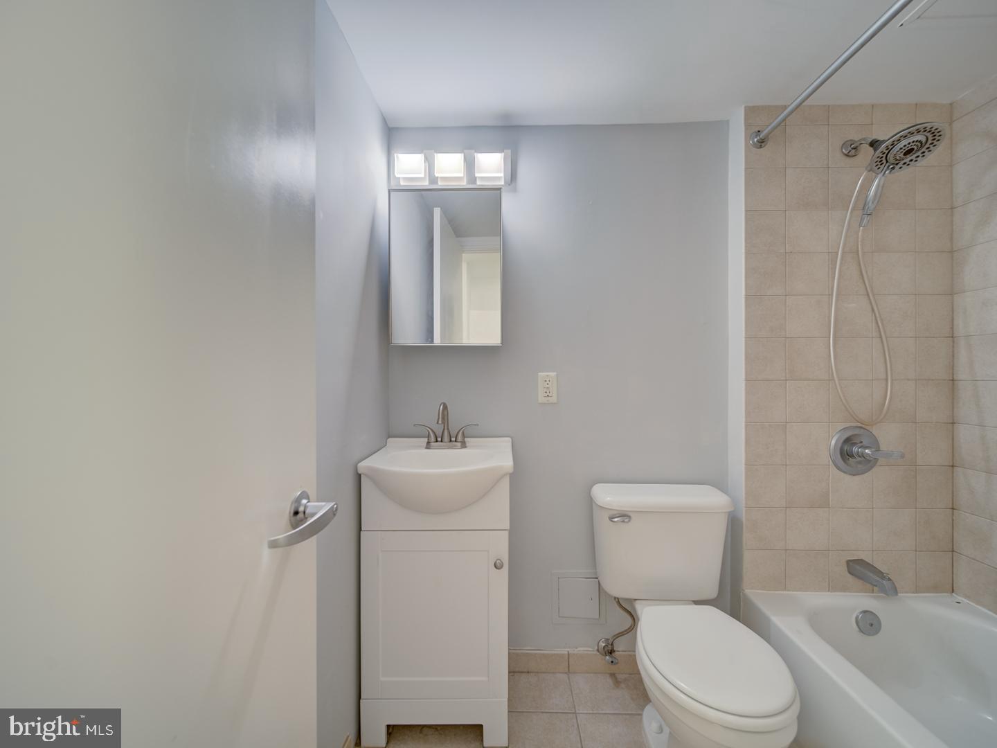 800 4th Street Southwest, Unit N703 Washington, DC 20024 - Photo 22 of 25 a bathroom with a toilet sink shower and mirror