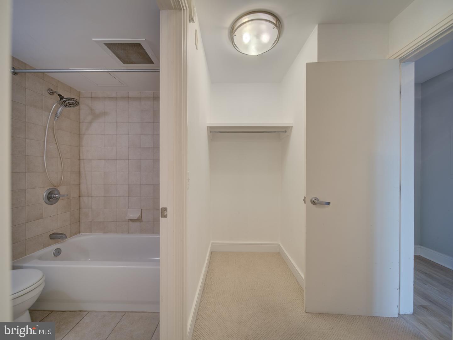800 4th Street Southwest, Unit N703 Washington, DC 20024 - Photo 24 of 25 a bathroom with a bathtub toilet and sink