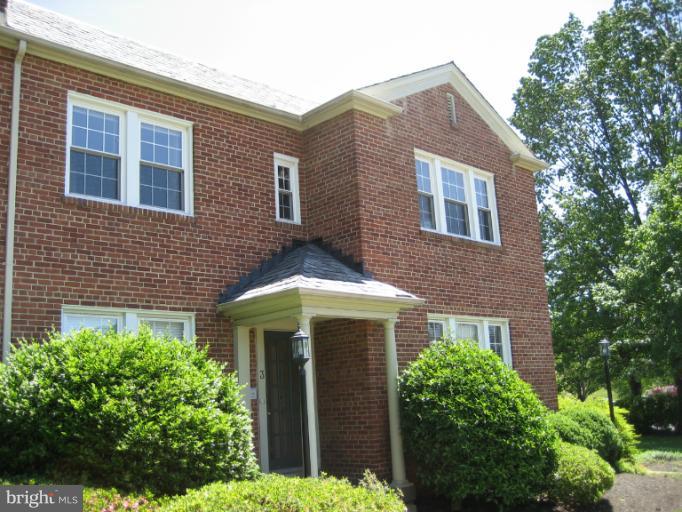 9 Russell Road, Unit 9B Alexandria, VA 22301 - Photo 1 of 1 a front view of a house with garden