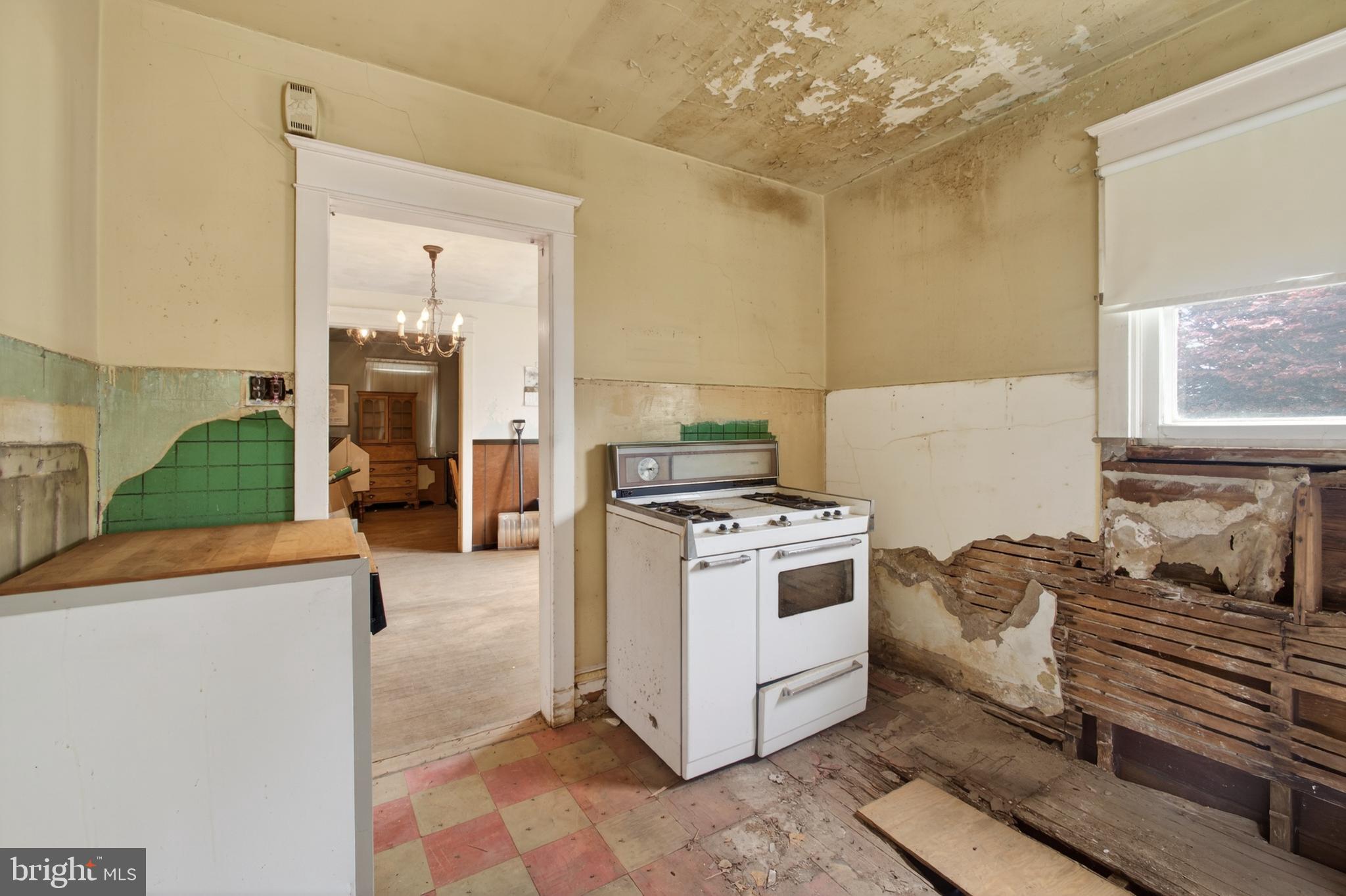 2583 Radcliffe Road Broomall, PA 19008 - Photo 4 of 12 a kitchen with a stove and a refrigerator