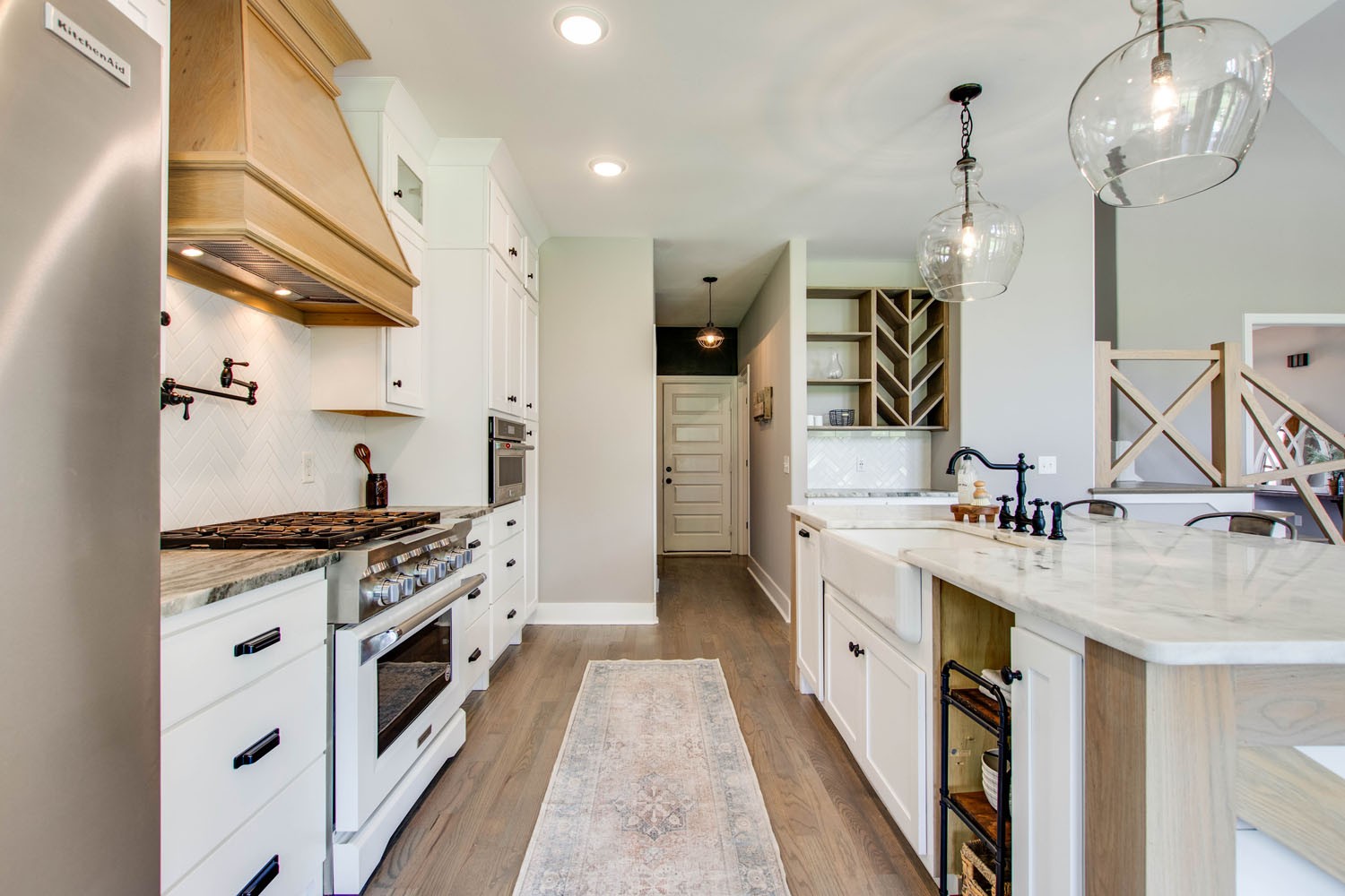 2502 Armstrong Valley Road Murfreesboro, TN 37128 - Photo 12 of 31 a large kitchen with stainless steel appliances granite countertop a stove and a sink