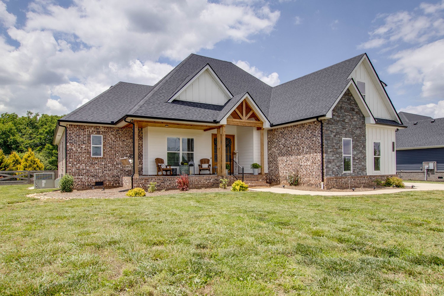 2502 Armstrong Valley Road Murfreesboro, TN 37128 - Photo 2 of 31 a front view of a house with a garden and yard