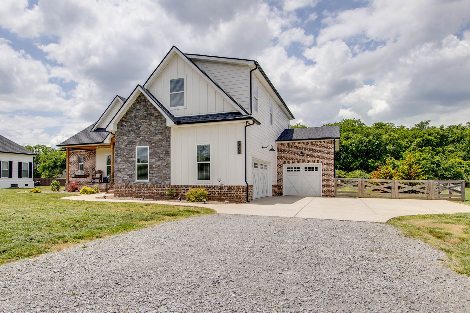 2502 Armstrong Valley Road Murfreesboro, TN 37128 - Photo 3 of 31 a front view of a house with a yard and garage
