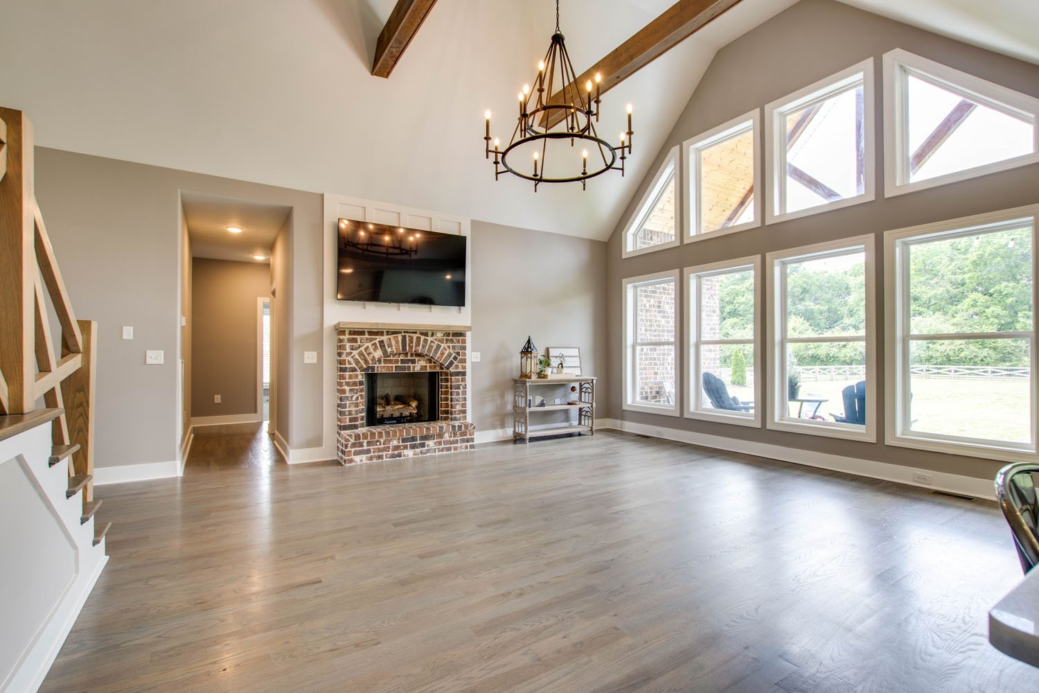 2502 Armstrong Valley Road Murfreesboro, TN 37128 - Photo 9 of 31 a view of an empty room with wooden floor fireplace and a window