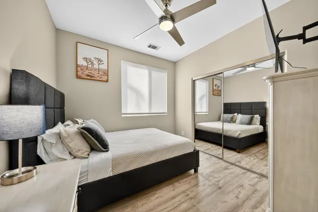 a bedroom with a bed and a couch