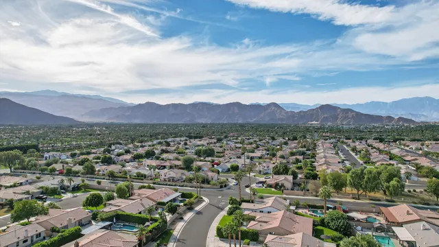 an aerial view of a city and mountain