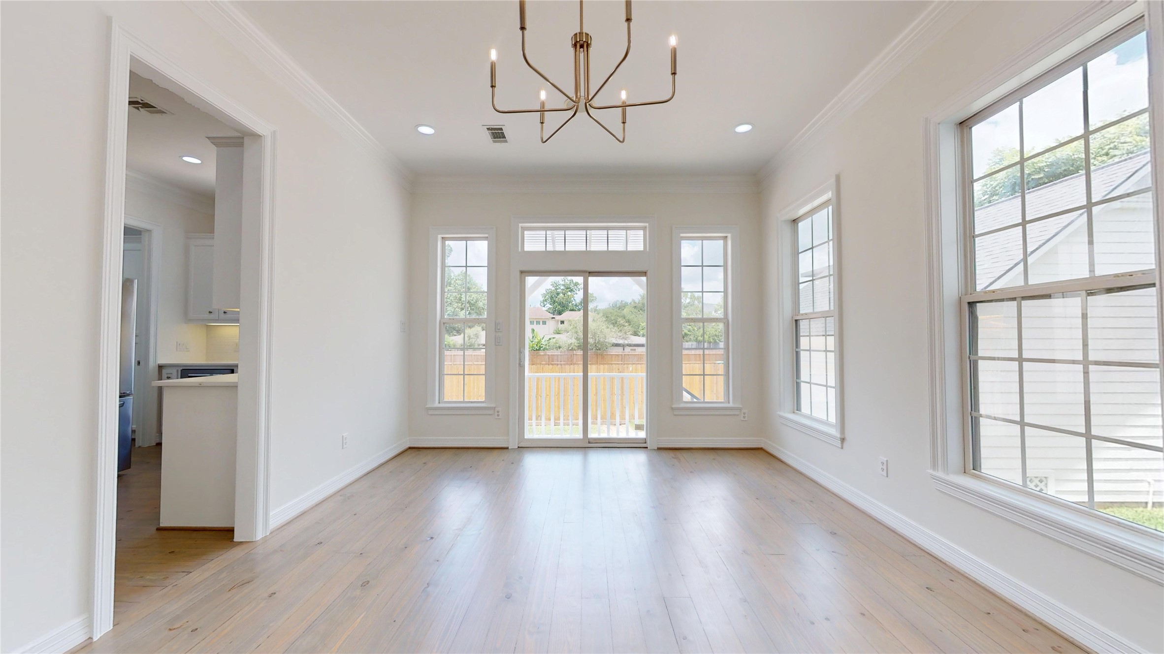 4050 Dumbarton Street Houston, TX 77025 - Photo 15 of 48 Large Family Room with updated lighting, refinished Pinewood Floors. Lots of natural light filtering through this updated home.