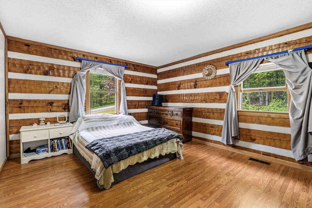 22 Lyon Hill Road Chester, MA 01011 - Photo 20 of 38 a bedroom with a bed and a large window