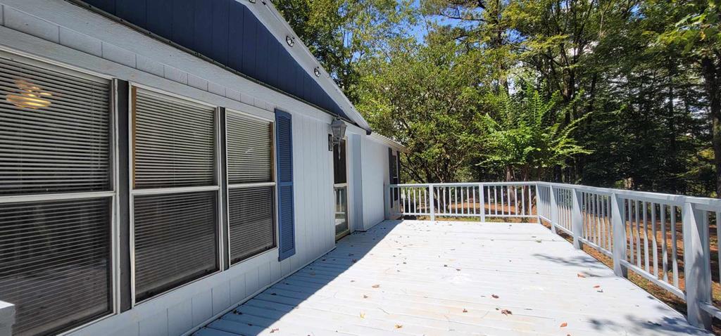 125 Sputnik Street Fortson, GA 31808 - Photo 10 of 30 a view of balcony with wooden floor and fence
