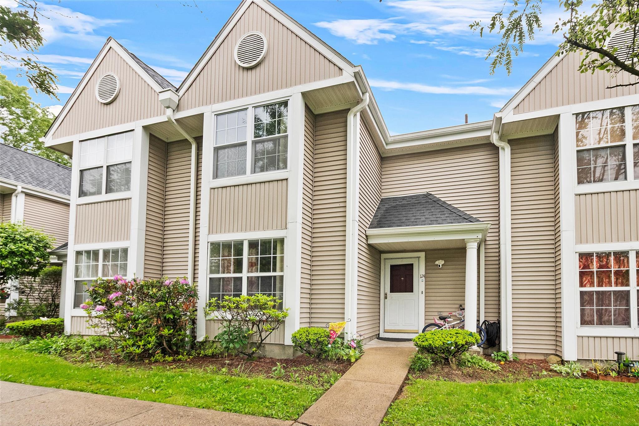 a front view of a house with garden