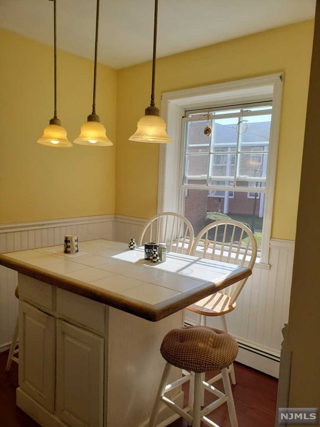 a kitchen with a table and chairs