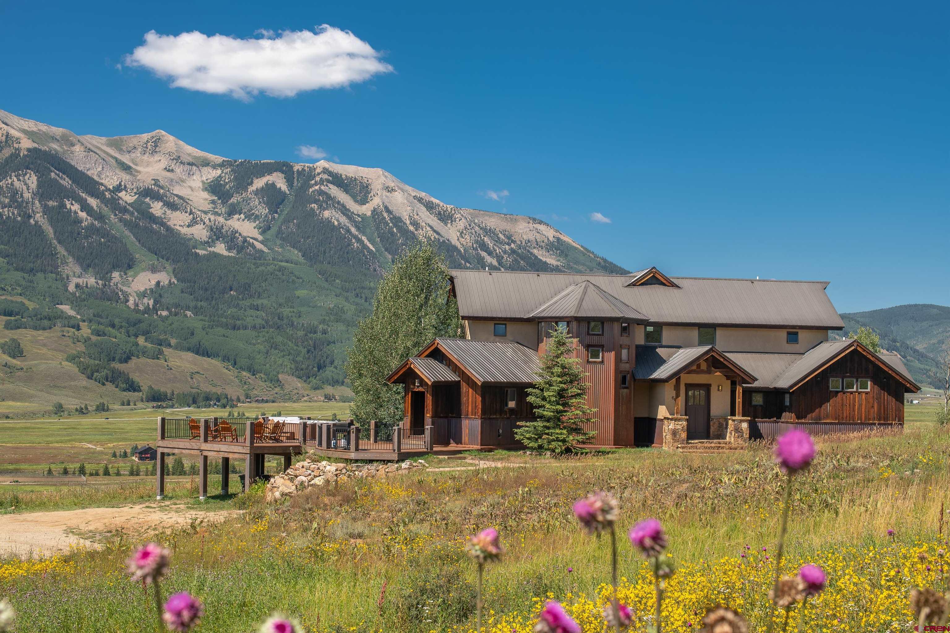 660 Lower Highlands Road Crested Butte, CO 81224 - Photo 1 of 31 a view of multiple houses with a big yard