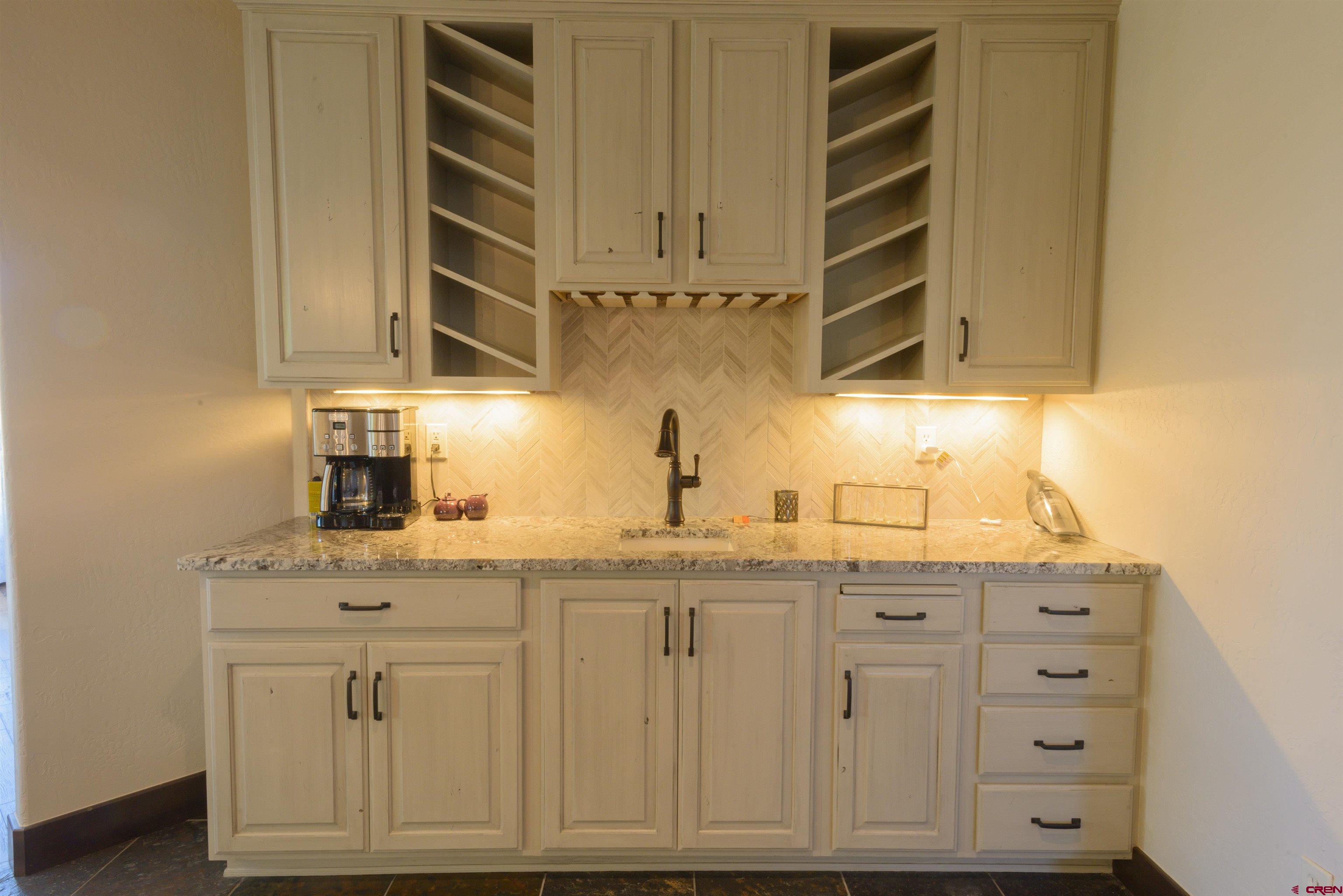 660 Lower Highlands Road Crested Butte, CO 81224 - Photo 11 of 31 a kitchen with cabinets and window