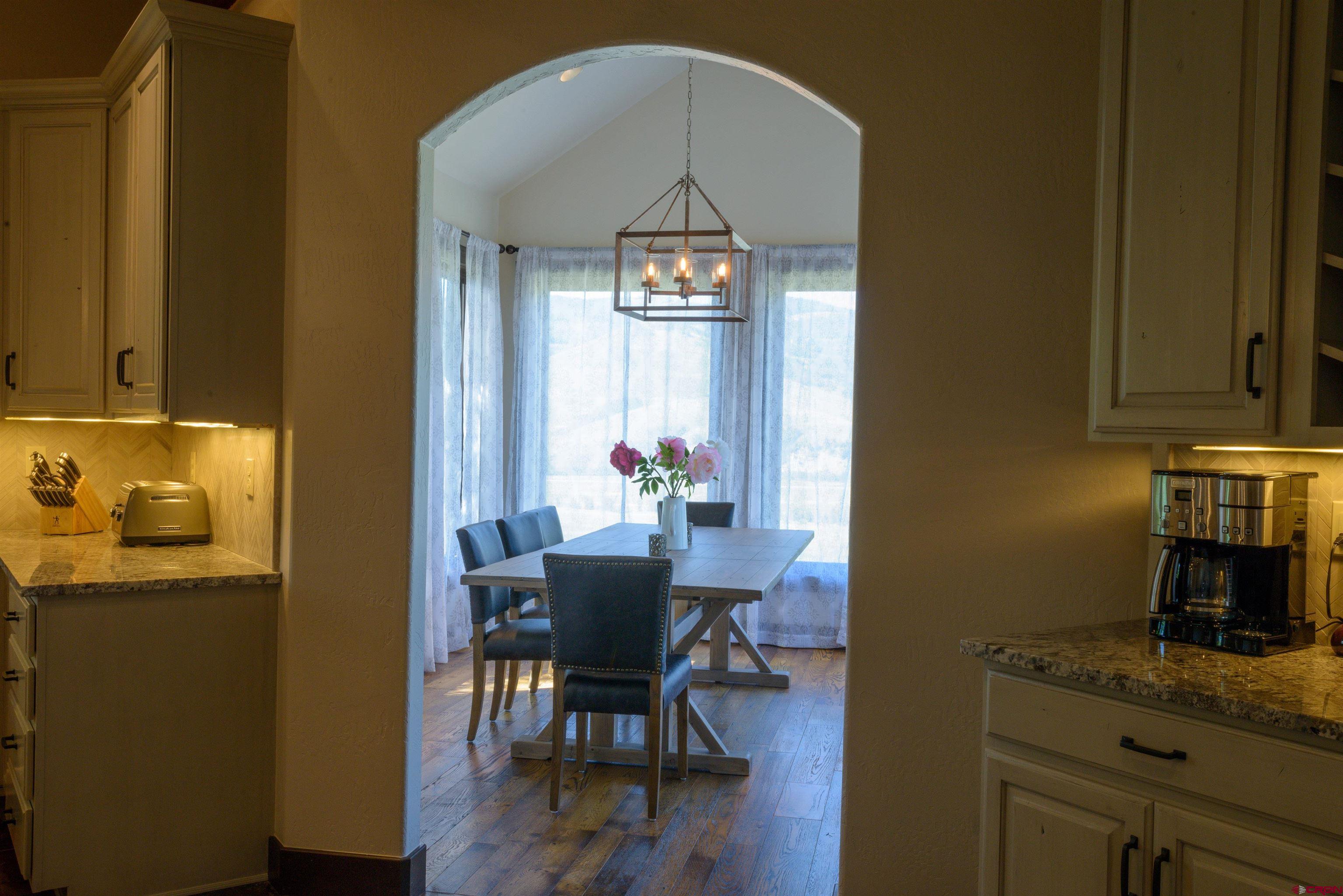 660 Lower Highlands Road Crested Butte, CO 81224 - Photo 12 of 31 a dining room with furniture and wooden floor