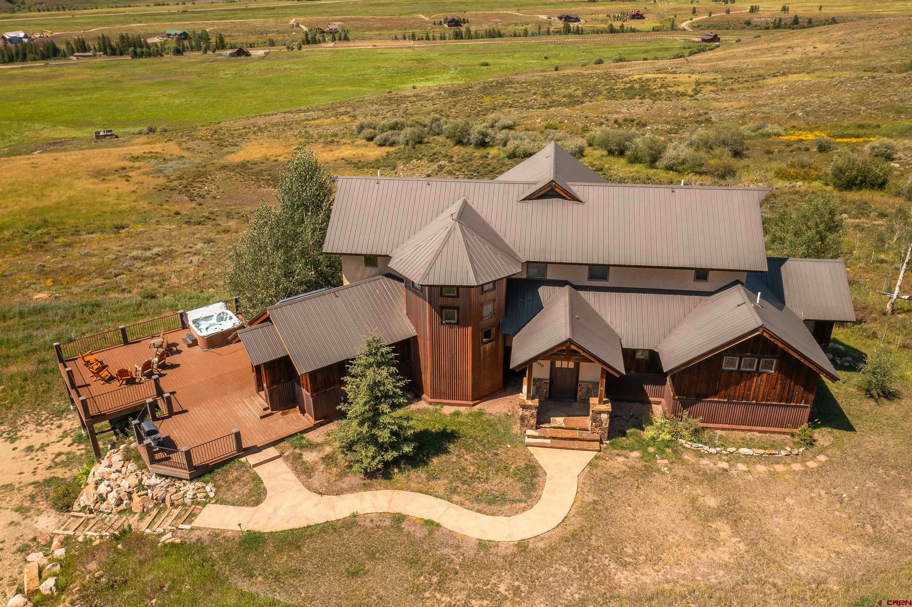 660 Lower Highlands Road Crested Butte, CO 81224 - Photo 2 of 31 an aerial view of a house with a ocean view
