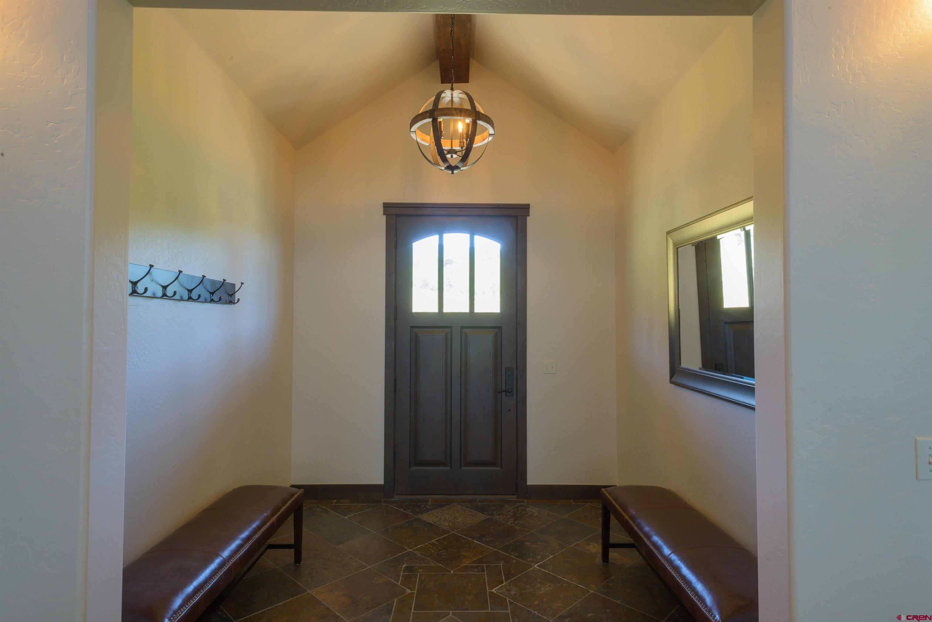 660 Lower Highlands Road Crested Butte, CO 81224 - Photo 22 of 31 a view of an entryway with a chandelier