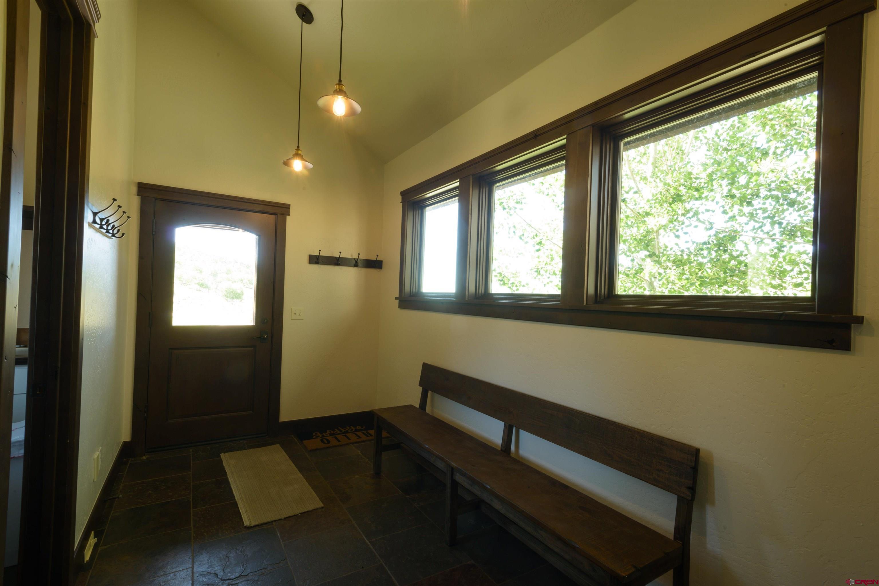 660 Lower Highlands Road Crested Butte, CO 81224 - Photo 26 of 31 a room with wooden floor and windows