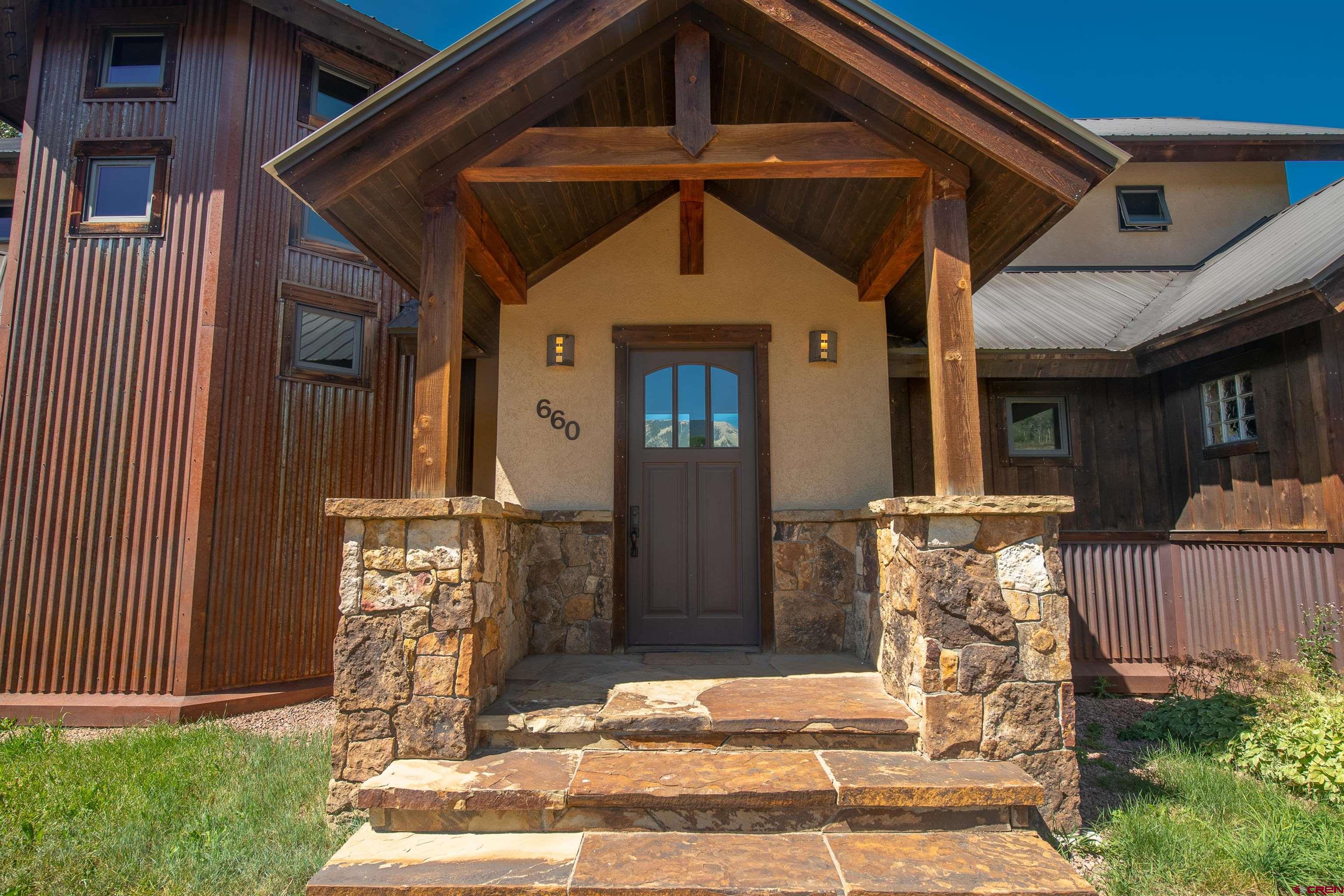660 Lower Highlands Road Crested Butte, CO 81224 - Photo 6 of 31 a front view of a house