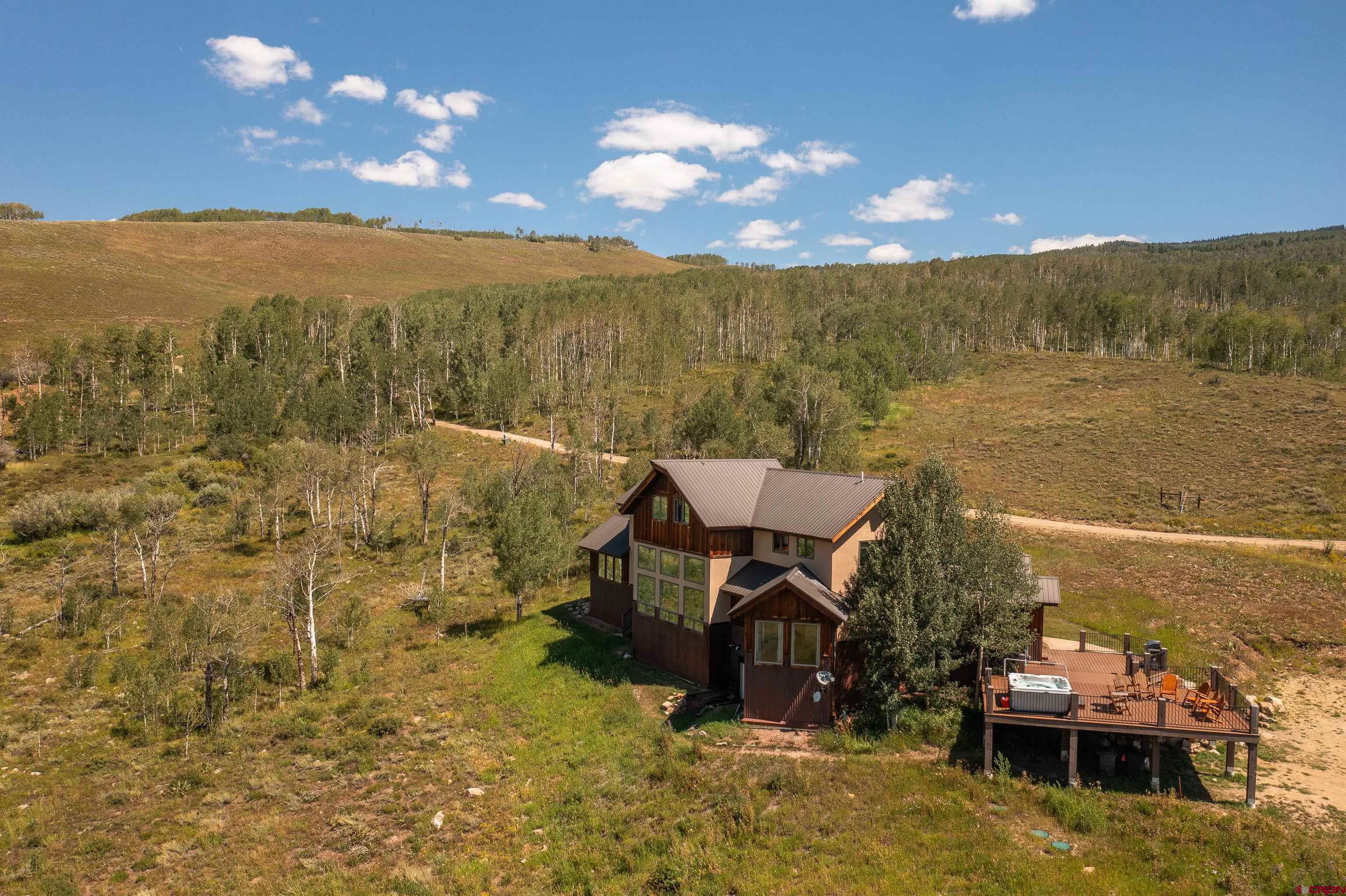 660 Lower Highlands Road Crested Butte, CO 81224 - Photo 8 of 31 a view of a terrace with chairs
