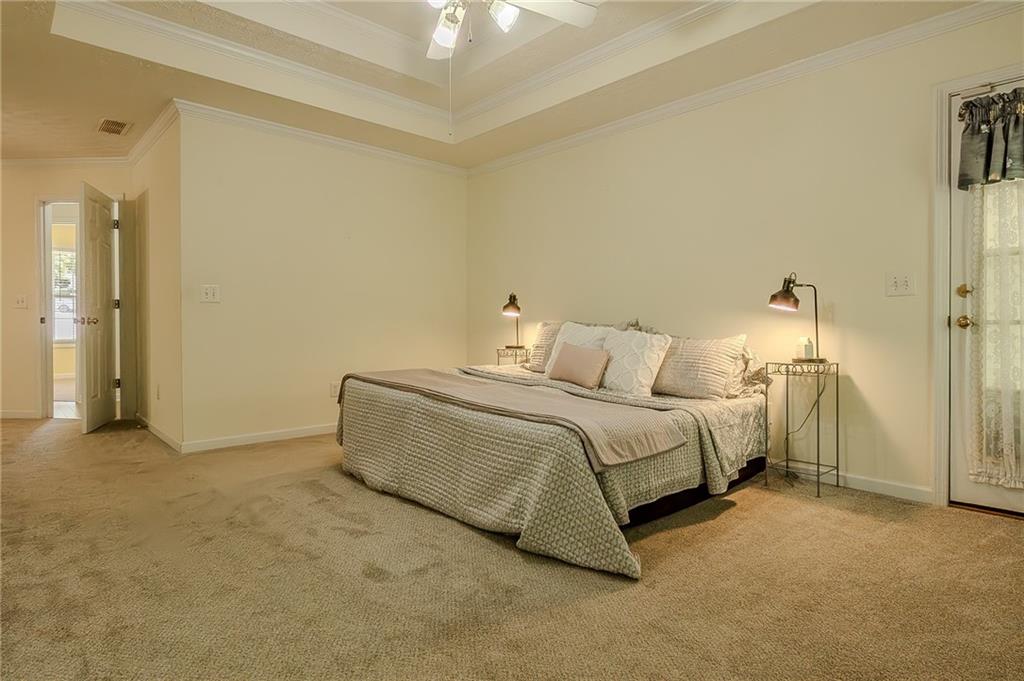 160 Vinny's Way Covington, GA 30014 - Photo 14 of 51 a bedroom with a bed and a cabinets