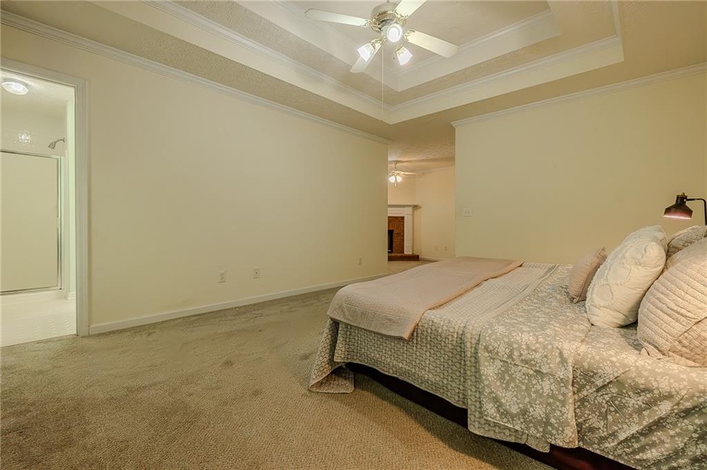 160 Vinny's Way Covington, GA 30014 - Photo 15 of 51 a bedroom with a bed and a chandelier