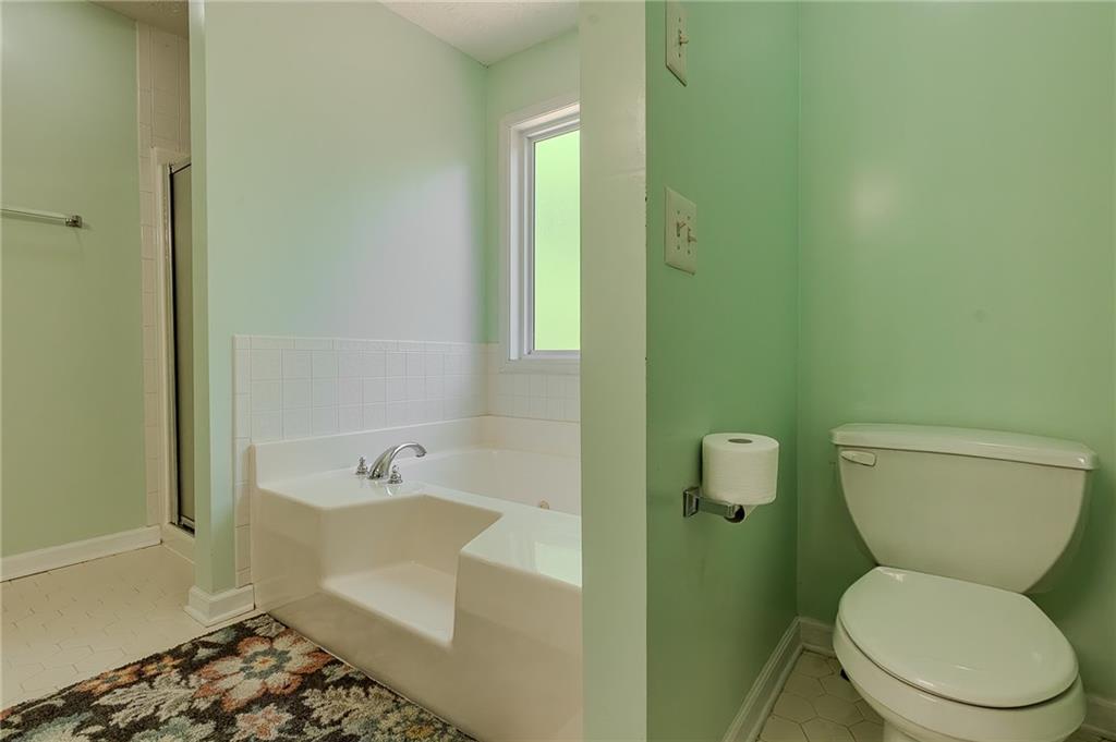160 Vinny's Way Covington, GA 30014 - Photo 17 of 51 a white toilet sitting next to a bath tub