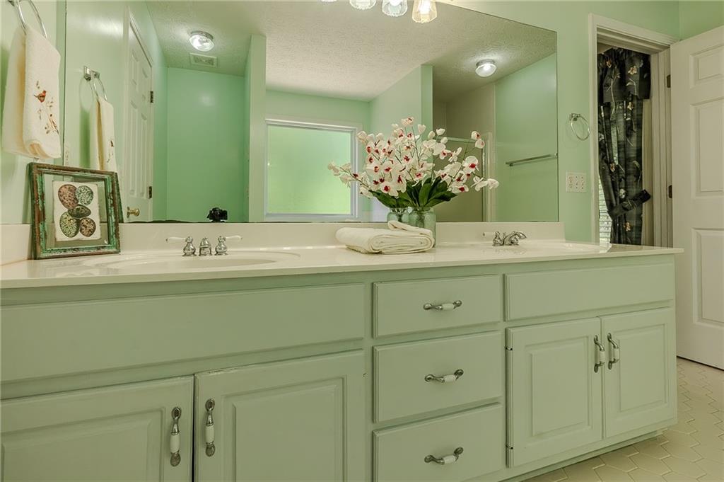 160 Vinny's Way Covington, GA 30014 - Photo 18 of 51 a bathroom with a sink vanity granite and a mirror