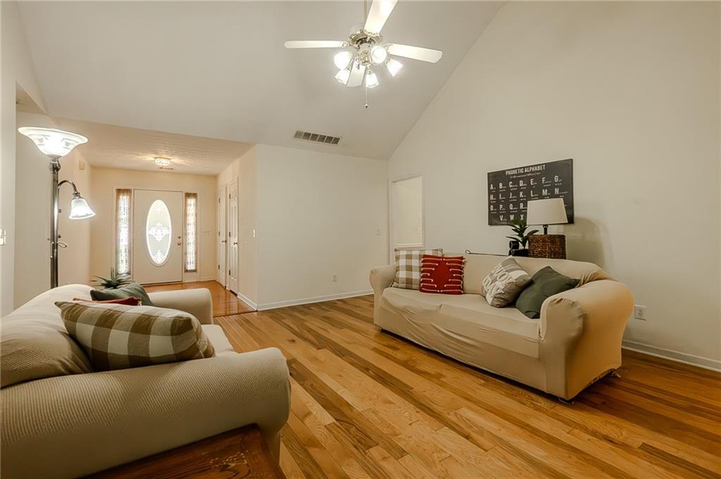 160 Vinny's Way Covington, GA 30014 - Photo 4 of 51 a living room with furniture and a large mirror
