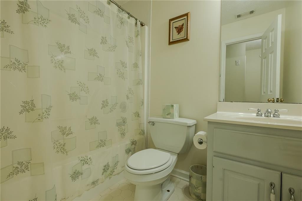 160 Vinny's Way Covington, GA 30014 - Photo 10 of 51 a bathroom with a sink a toilet and a mirror