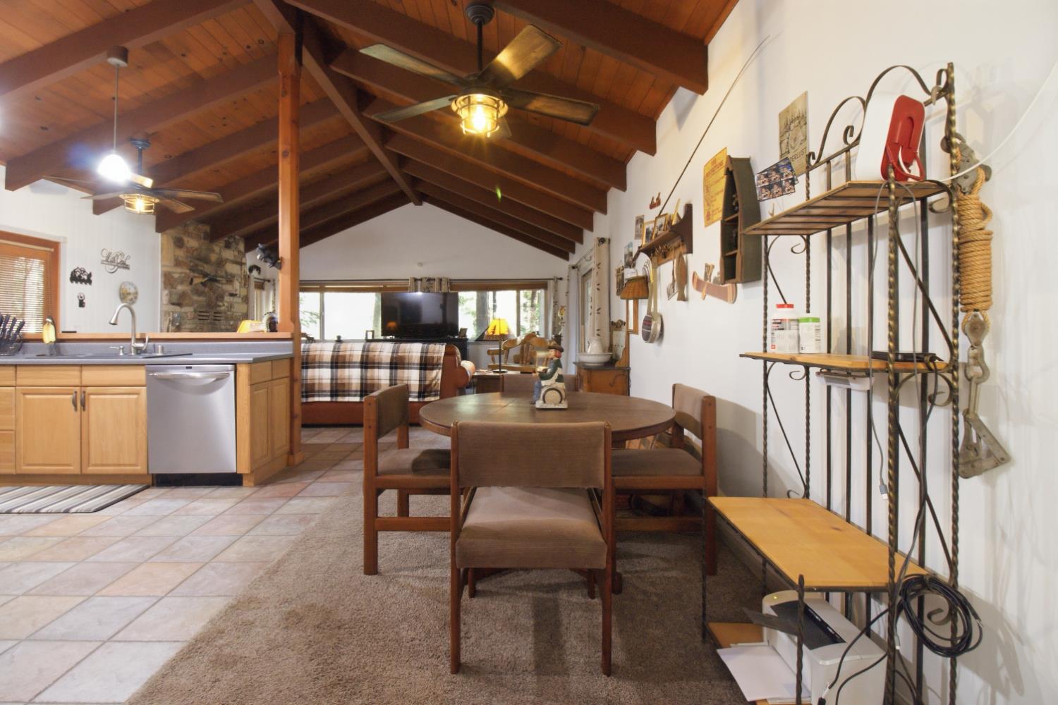 4599 Rivendale Road Placerville, CA 95667 - Photo 8 of 27 a view of a dining room with furniture window and wooden floor