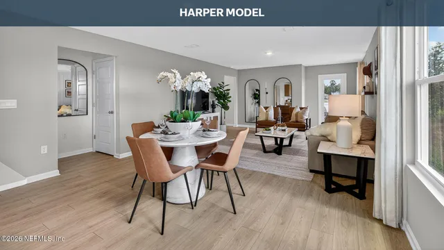 a view of a dining room with furniture and wooden floor