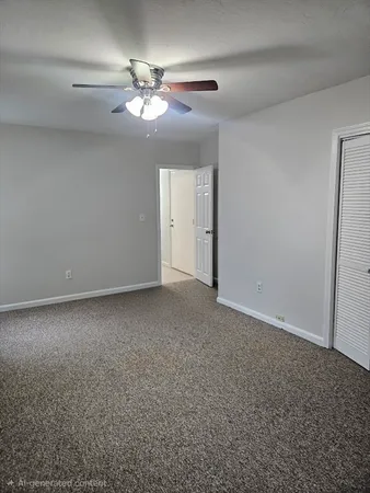a view of a chandelier fan and fire place