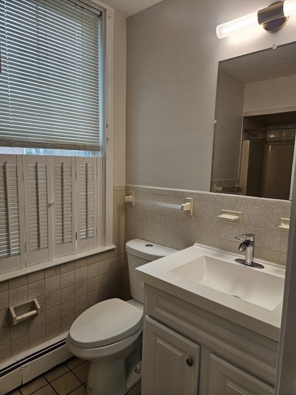 33 Rockland Street, Unit 2 Canton, MA 02021 - Photo 9 of 10 a bathroom with a sink a toilet and mirror