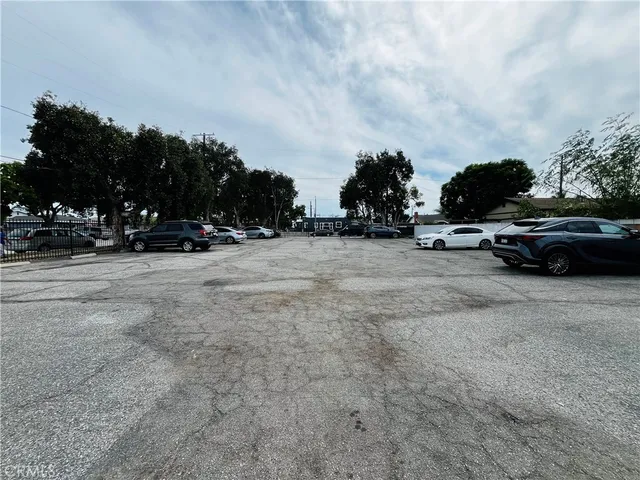 a view of street with parked cars