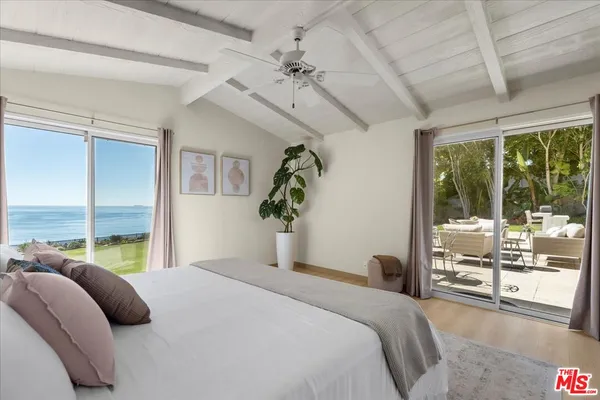 a living room with furniture a fireplace and a table